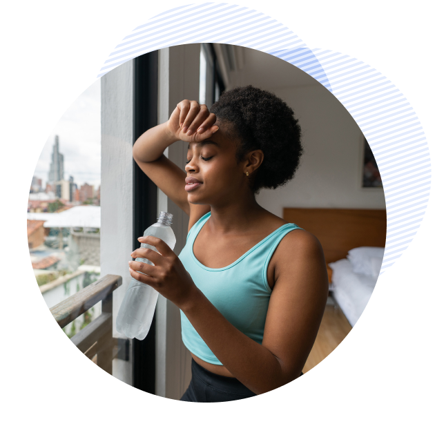 A female member drinking water, doing better