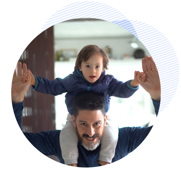 happy man carring his son on his shoulders