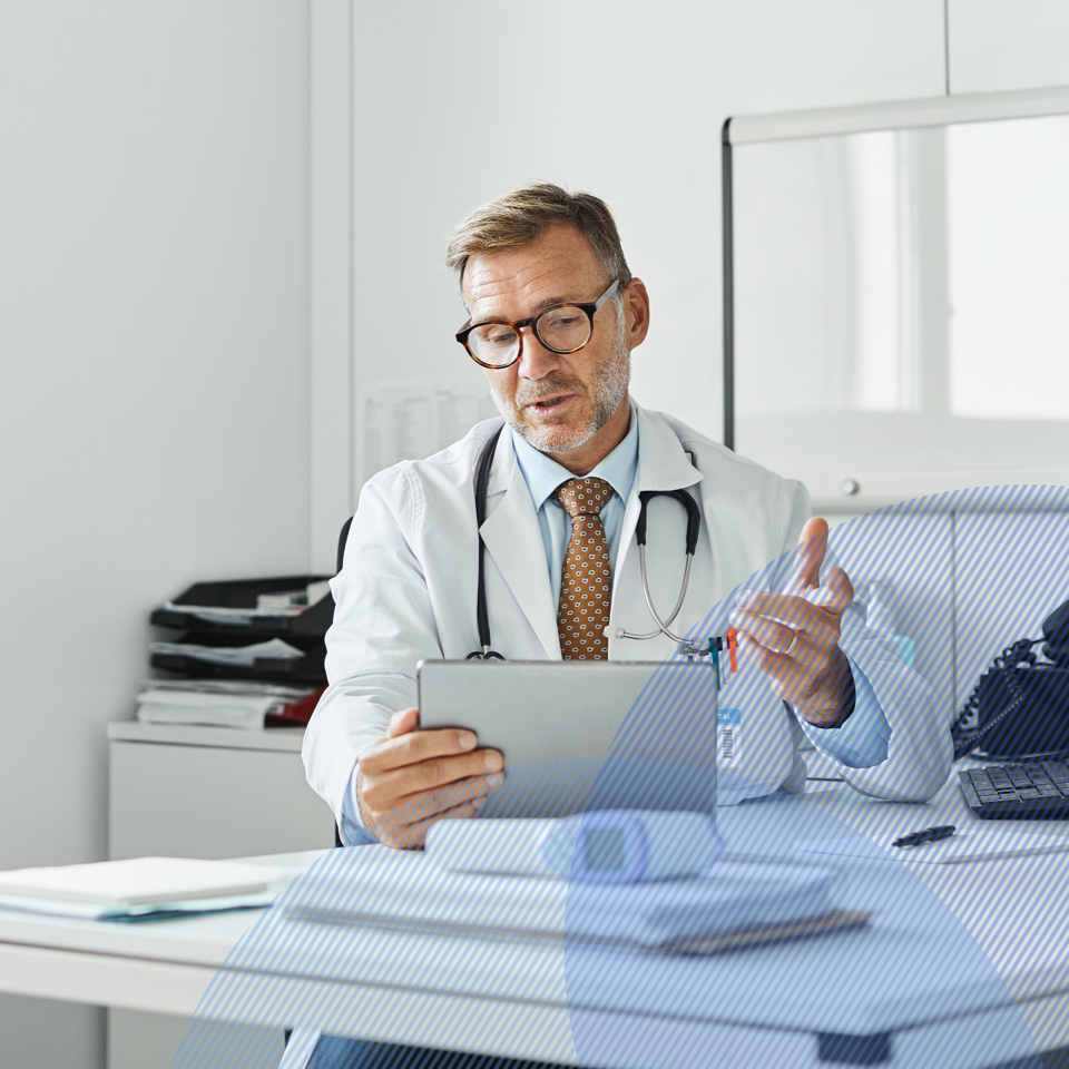 Physician talking to a patient on a laptop