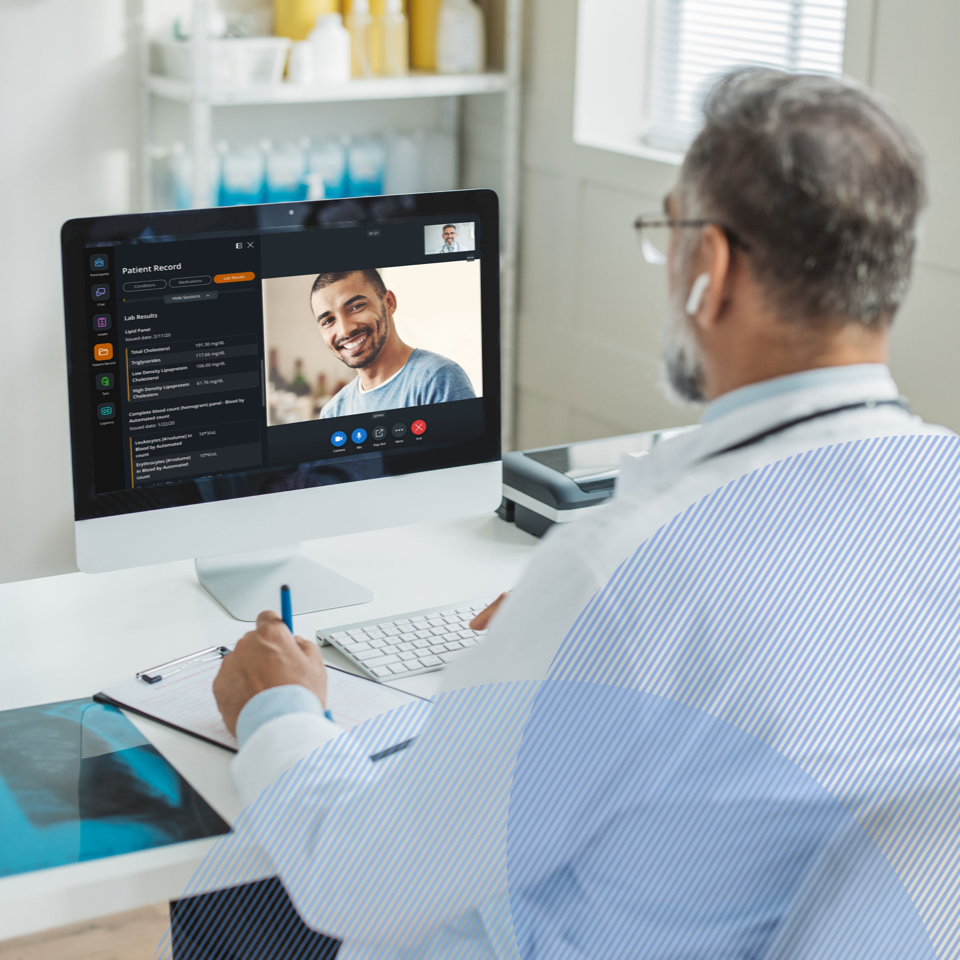 Doctor at his desk doing online consultation