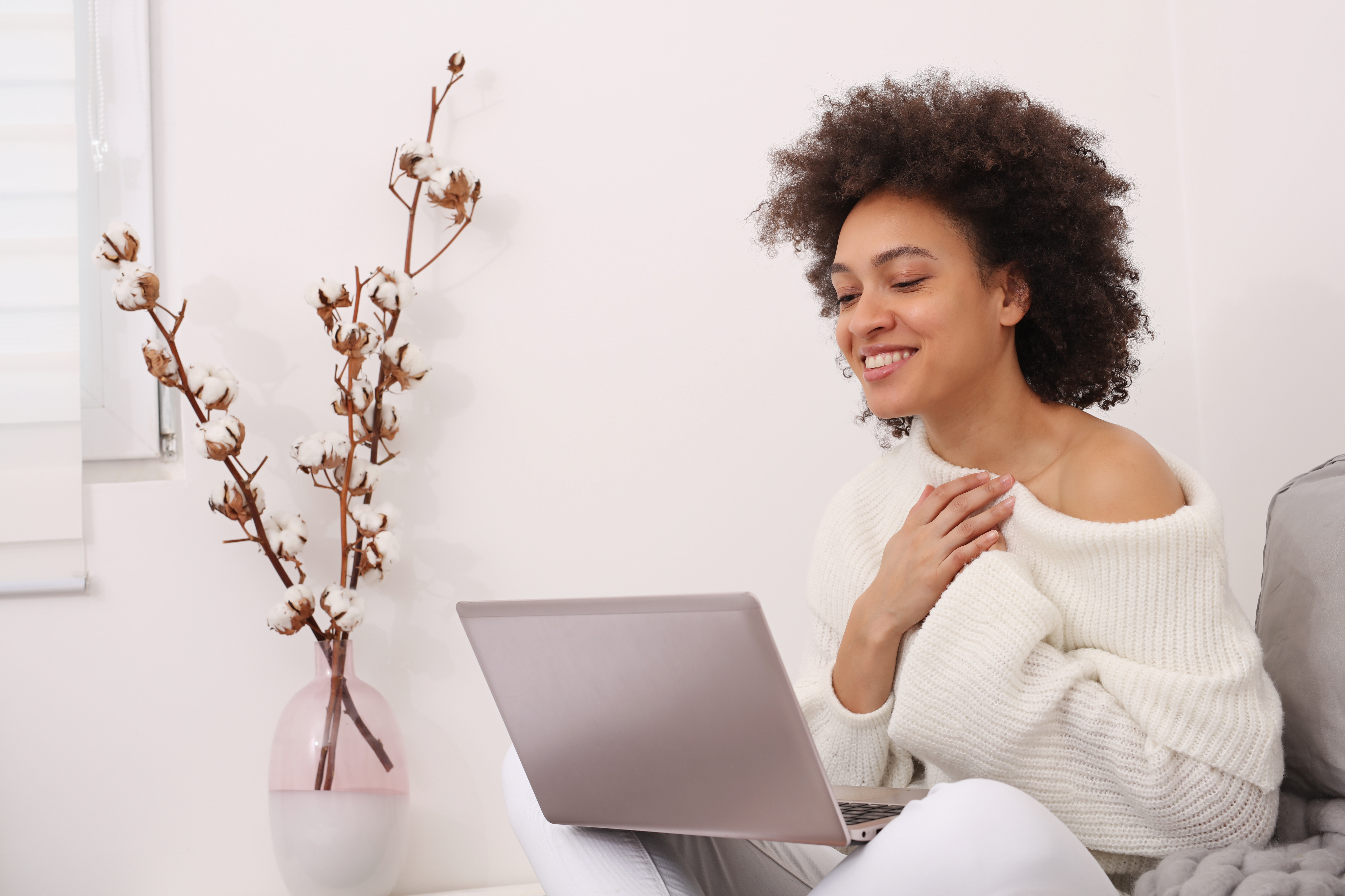African-American woman using online technology to talk to a therapist