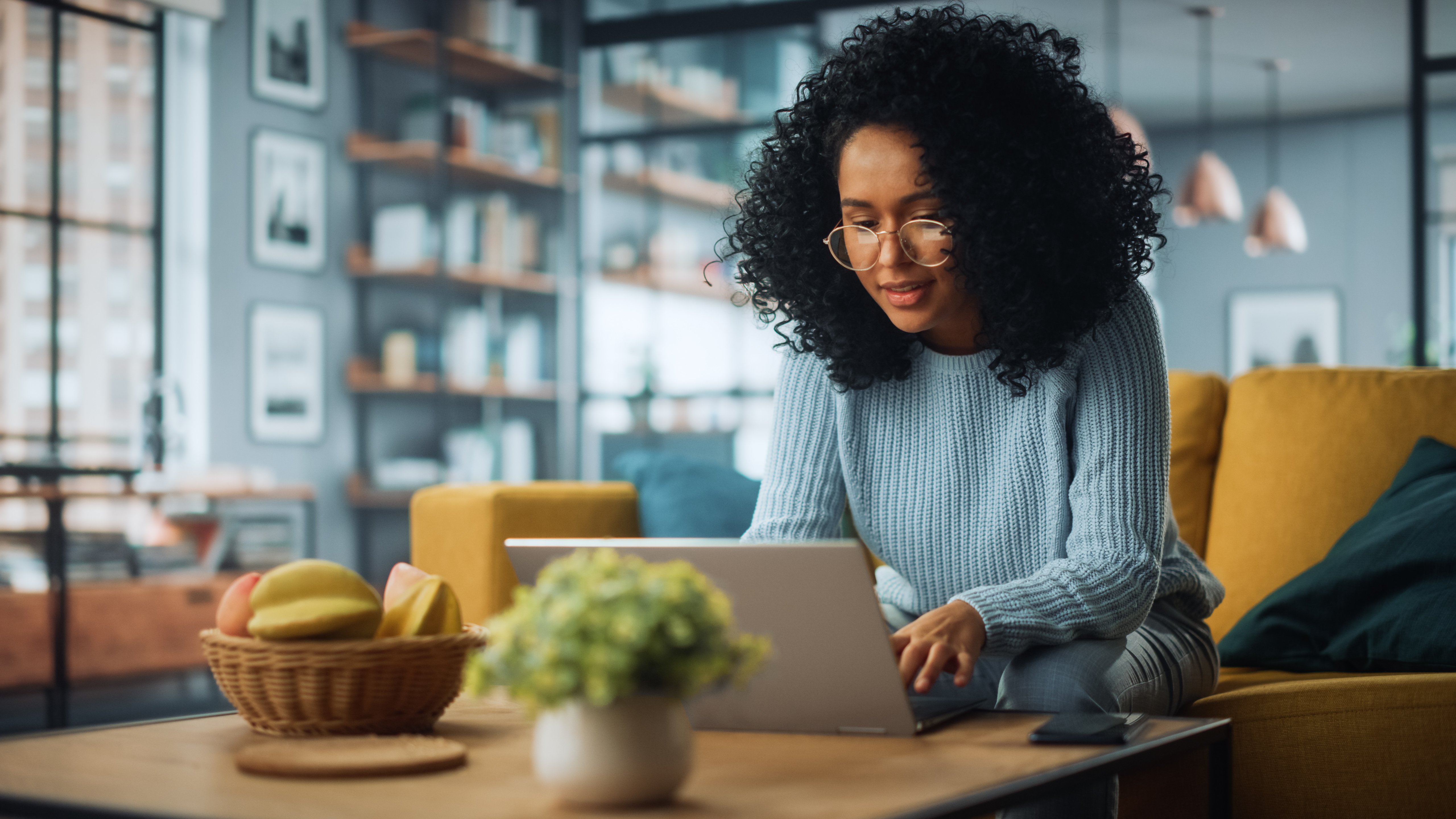 young african american woman talking to a provider on her laptop